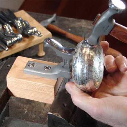 Planishing a silver form by hand